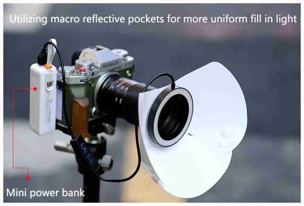 White macro photography ring light reflector with attached mini power bank mounted on a camera lens for fill lighting.
