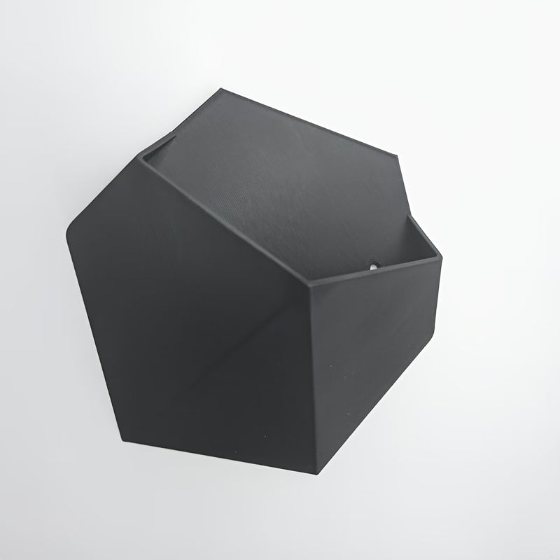 Black hexagonal wall planter with open top and side mounting holes, dark matte finish.