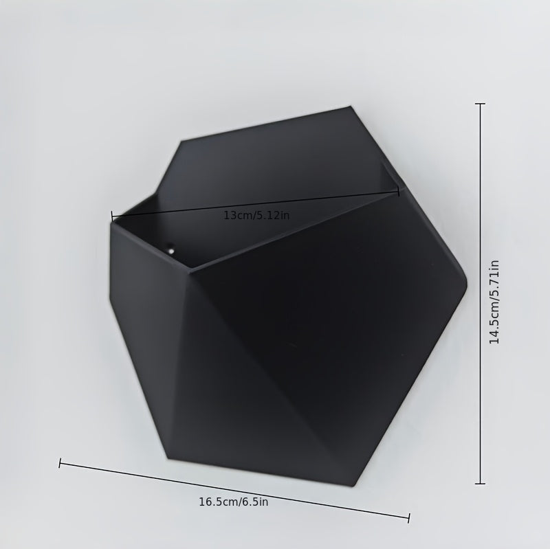 Black hexagonal wall planter, 16.5cm wide and 14.5cm tall, open top with mounting holes.