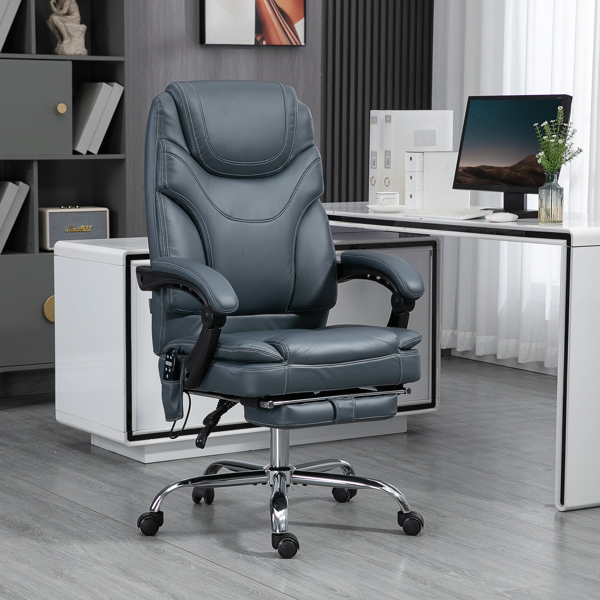 Gray ergonomic massage recliner chair with padded armrests and chrome wheeled base.