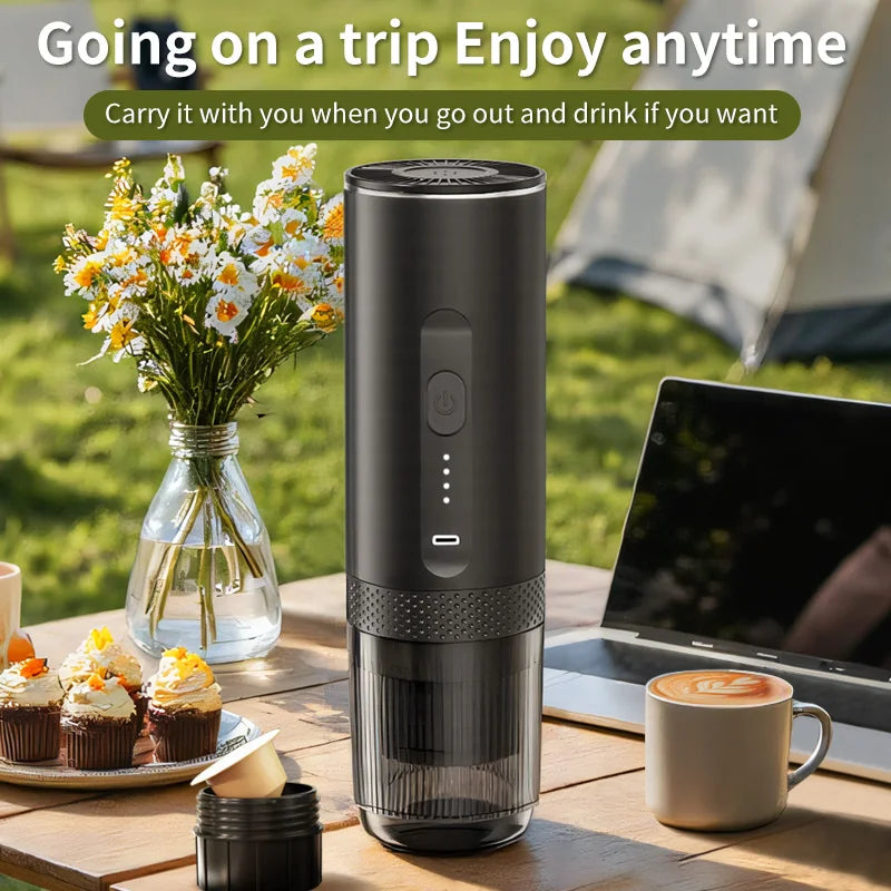 Portable matte black electric coffee maker for travel, featuring a compact cylindrical design and USB charging port.