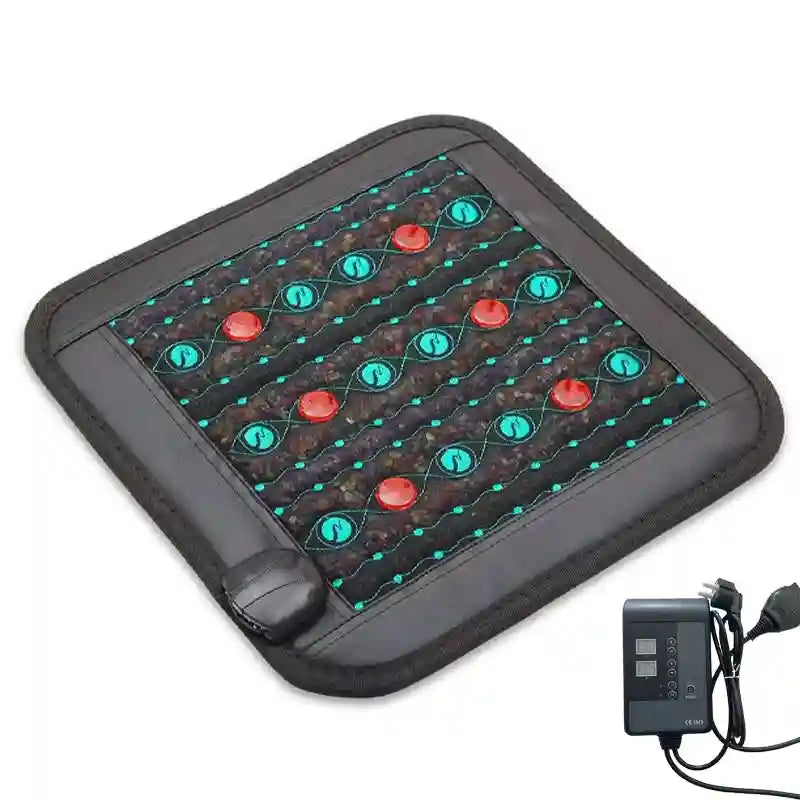 Square infrared heating pad with black synthetic material, red stone inserts, teal wave patterns, and wire controller.