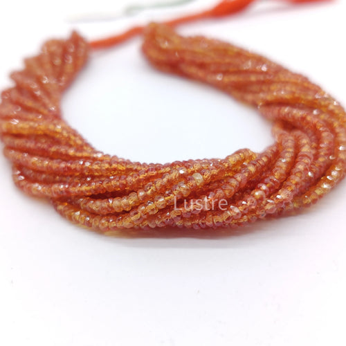 Orange sapphire rondelle bead strand with faceted texture, 18 in length.