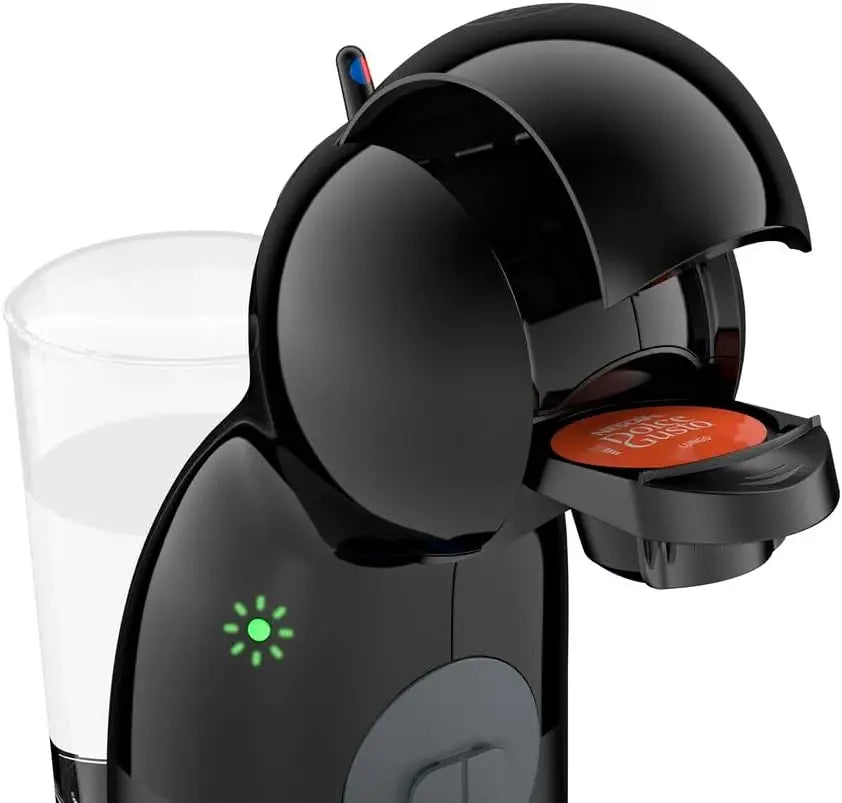 Black Nescafe Dolce Gusto capsule coffee machine with transparent water tank and green indicator light.