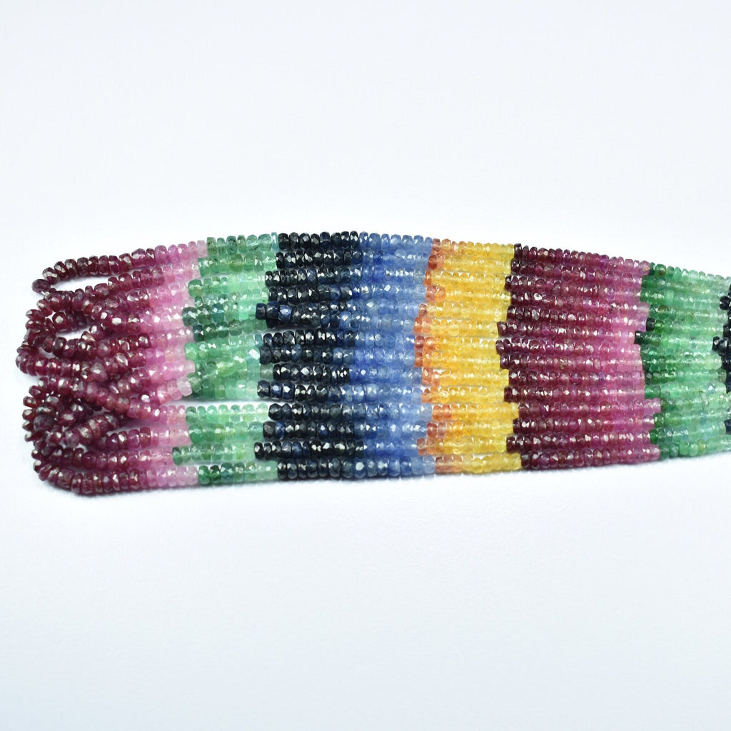 Flat view multicolor faceted rondelle bead strand with maroon, green, blue, and yellow blocks