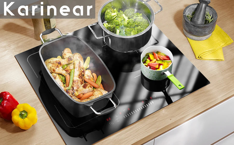 Black induction cooktop with flex zone and three pans cooking on the glass surface