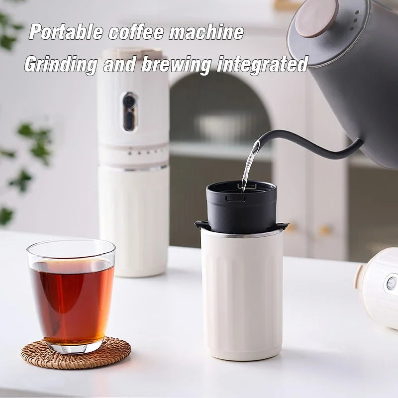 White portable coffee maker with integrated grinder, brewing into a compact cup using a gooseneck kettle.