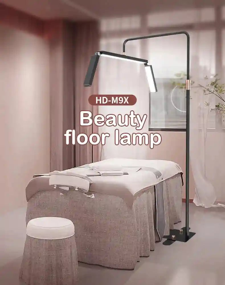 HD-M9X black metal floor lamp with adjustable LED arms for beauty treatments, positioned over a spa massage table.