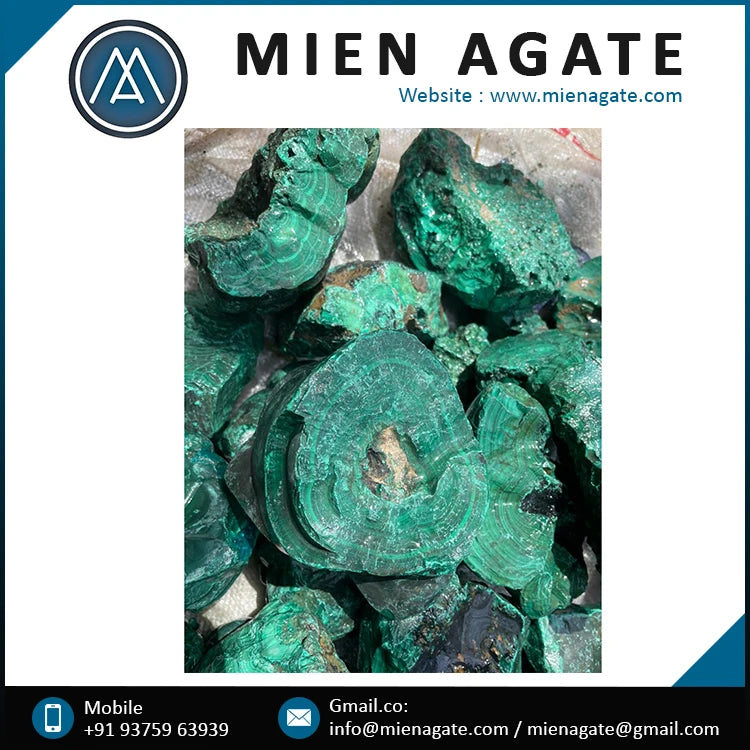 Pile of raw teal-green malachite rough crystals