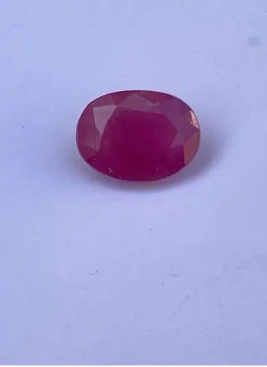 Oval faceted red gemstone, transparent loose stone