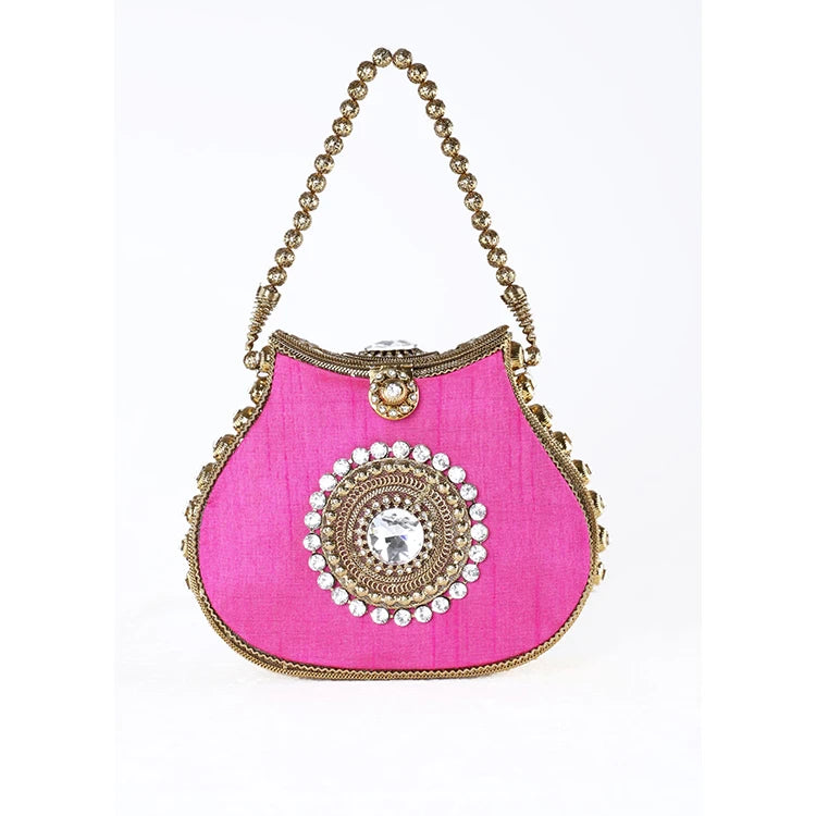 Hot pink silk designer handbag with gold beaded handle, crystal medallion center, and kiss lock closure.