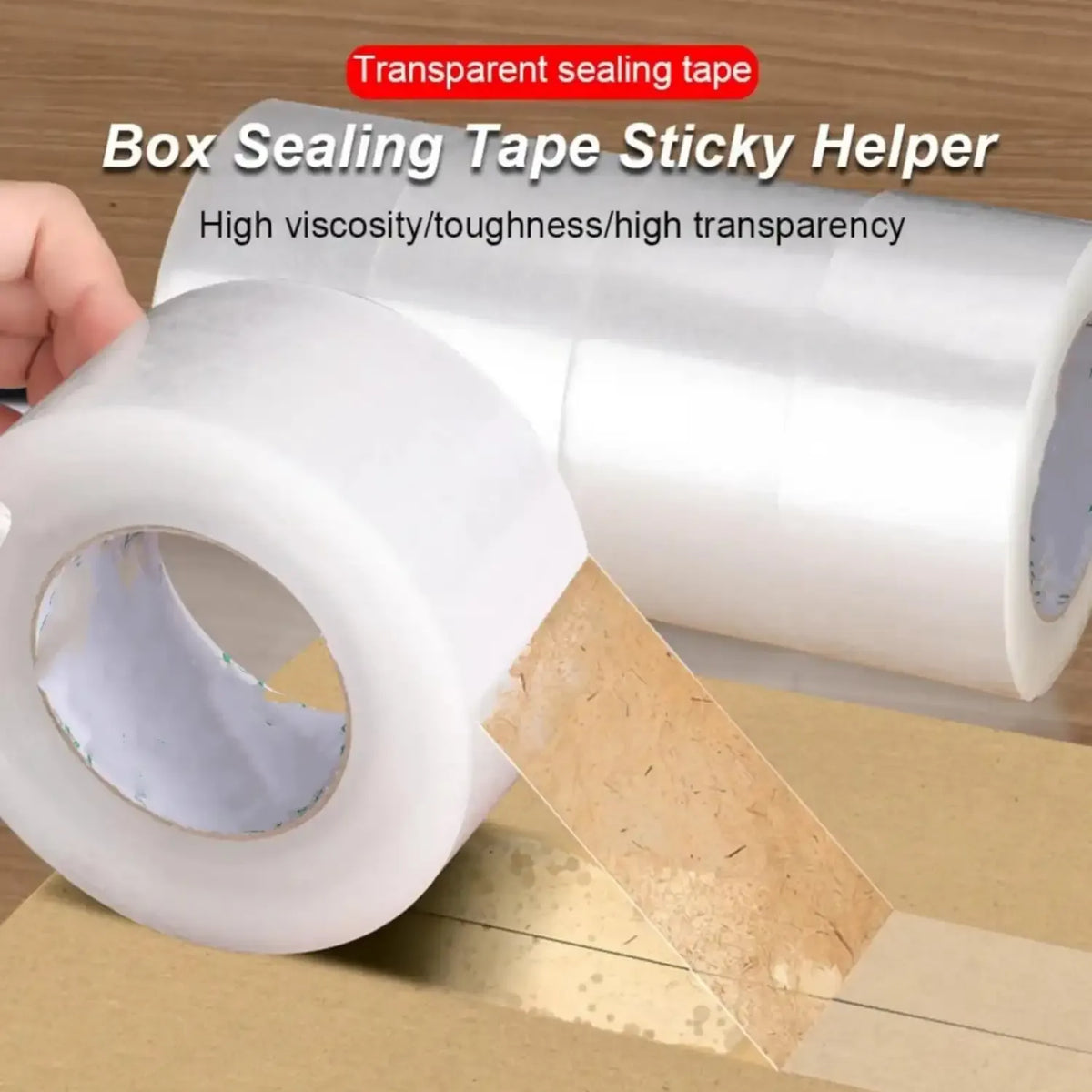Transparent sealing tape applied along cardboard box seam; clear adhesive roll