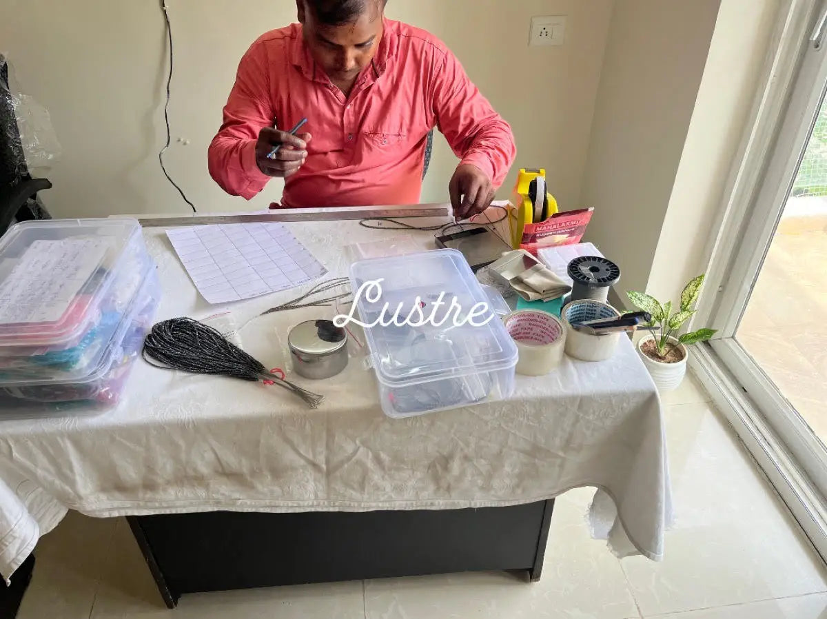 Jewelry making table with wire spools and plastic storage bins