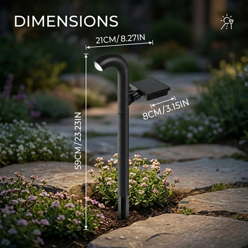Black solar pathway light stake with adjustable height, shown beside flowers and stone path