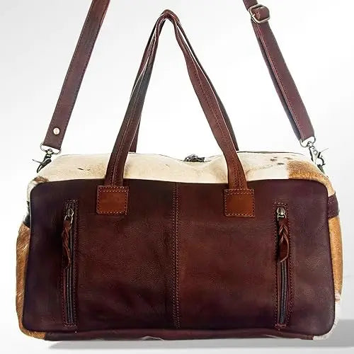 Vintage style unisex cowhide leather duffel travel bag with brown leather, white fur panels, and dual side zip pockets.