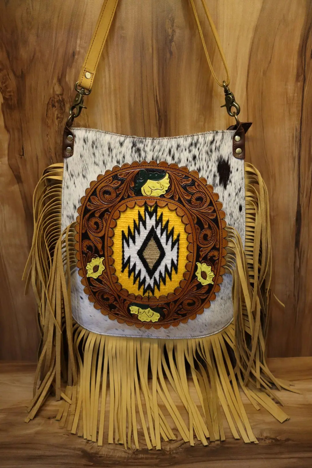 Genuine leather cowhide crossbody bag with Western tooling, yellow accent details, and long fringe tassel trim.