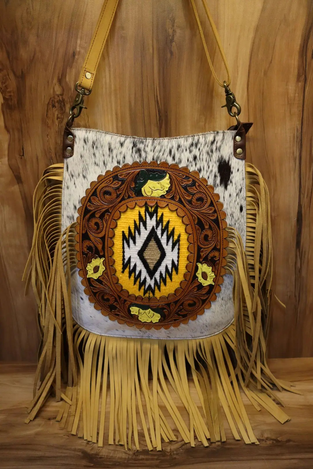 Genuine leather cowhide crossbody bag with Western tooling, yellow accent details, and long fringe tassel trim.
