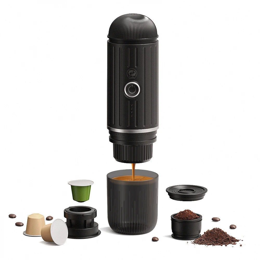 Portable black espresso maker for capsules and ground coffee with integrated cup on white background.