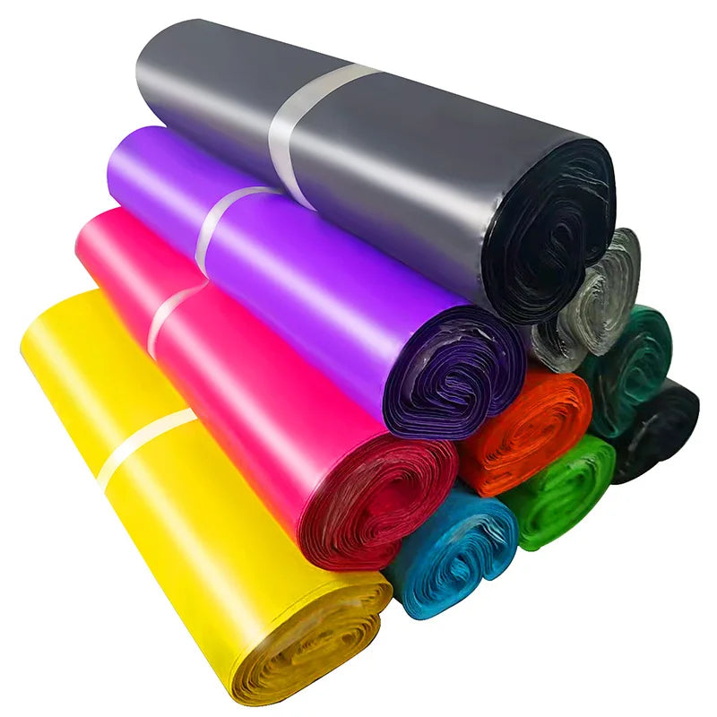 Shiny waterproof poly mailer bag rolls in gray, purple, pink, yellow, red, green, blue