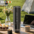 Balashov portable black electric espresso maker with battery indicator, used for coffee capsules on an outdoor table.