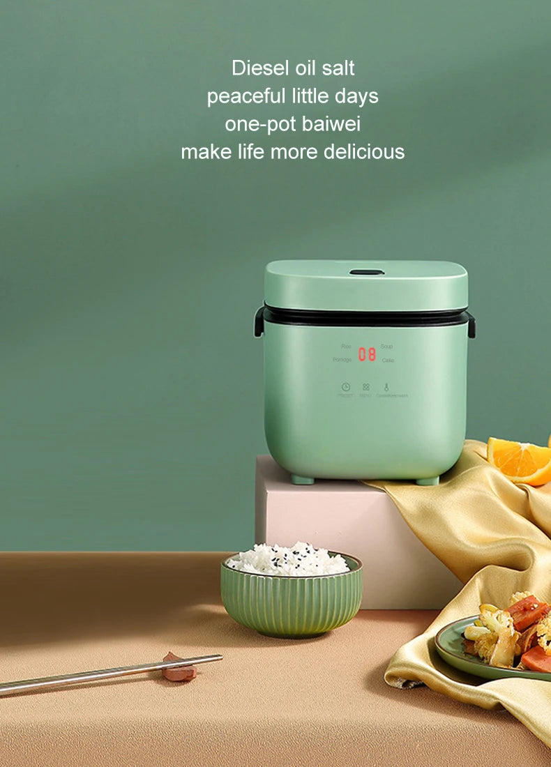 Mini electric rice cooker, mint teal pot with visible digital display and steam-ready use