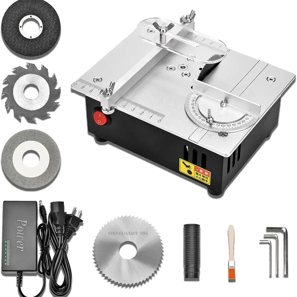 Desktop electric table saw with included blades, cord, hose, and hex key set
