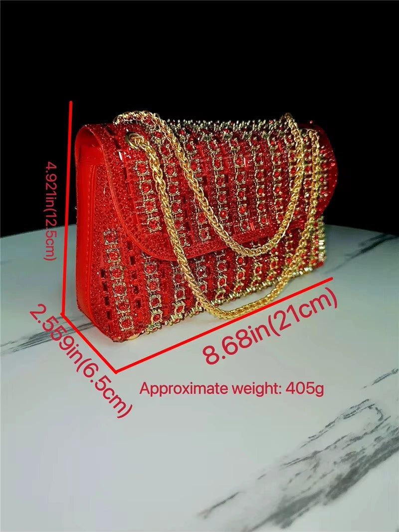 Red rhinestone embellished crossbody handbag with gold chain strap, luxury evening trunk style, compact travel purse.