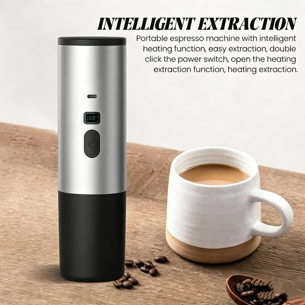 Silver and black portable espresso machine with heating function and digital display next to a coffee cup.