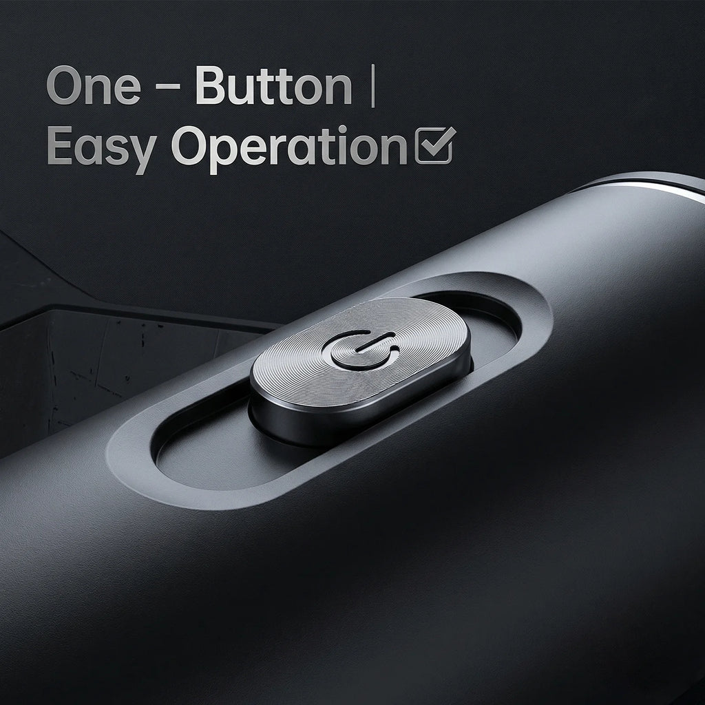 Close-up of a sleek matte black coffee maker featuring a circular metallic power button for easy one-button operation.
