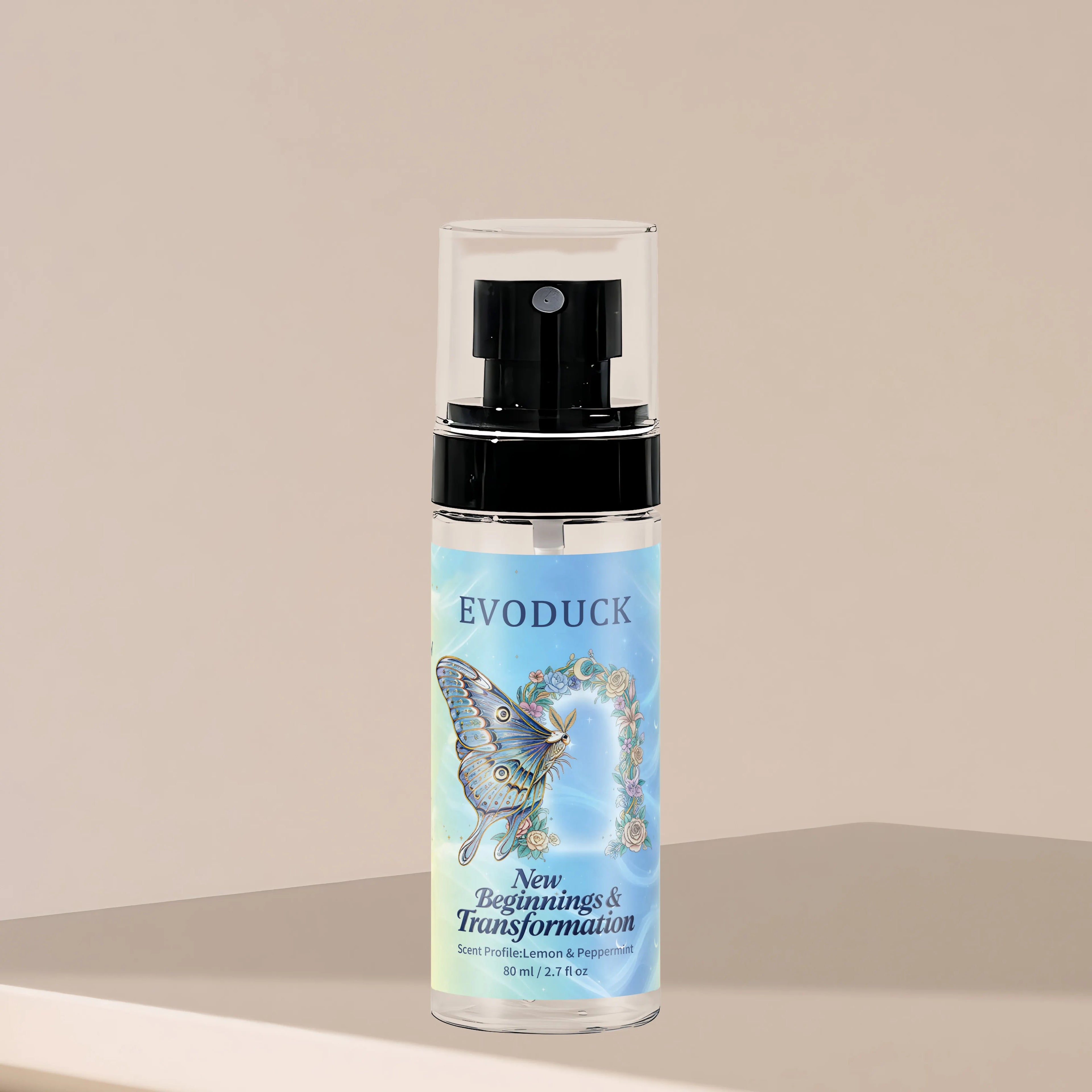 Evoduck Lemon & Peppermint body fragrance mist for women, 2.7oz travel-size spray in a clear cylindrical bottle.