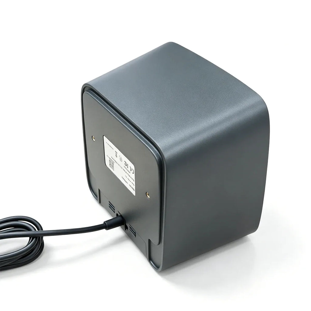Dark gray desktop 2D barcode scanner with front scanning window and attached USB cable