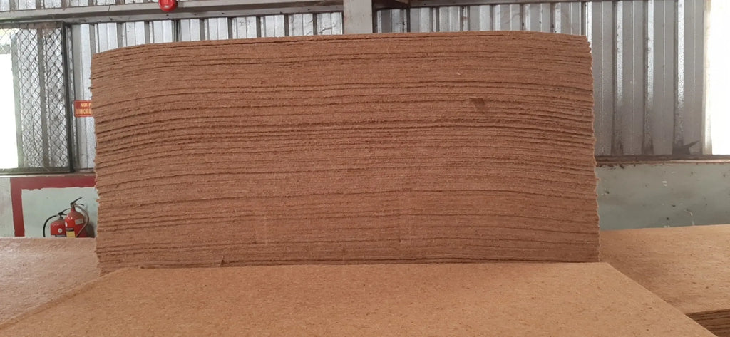Large brown coir sheet tape panel stacked in layers