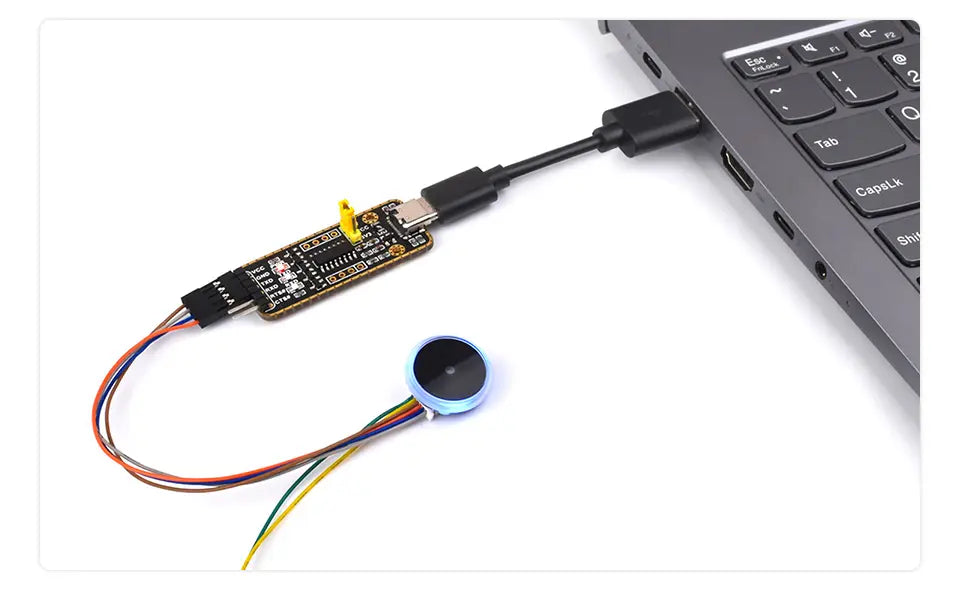 Barcode scanner module connected to a computer via cable with small round lens