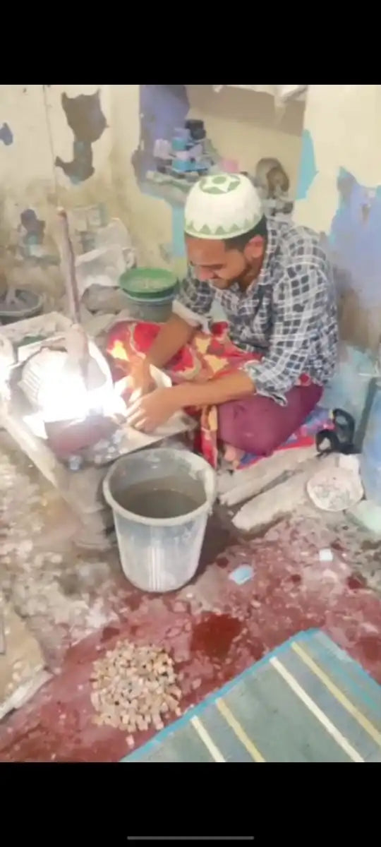Gemstone workshop scene with workers, buckets, and gemstone-making materials
