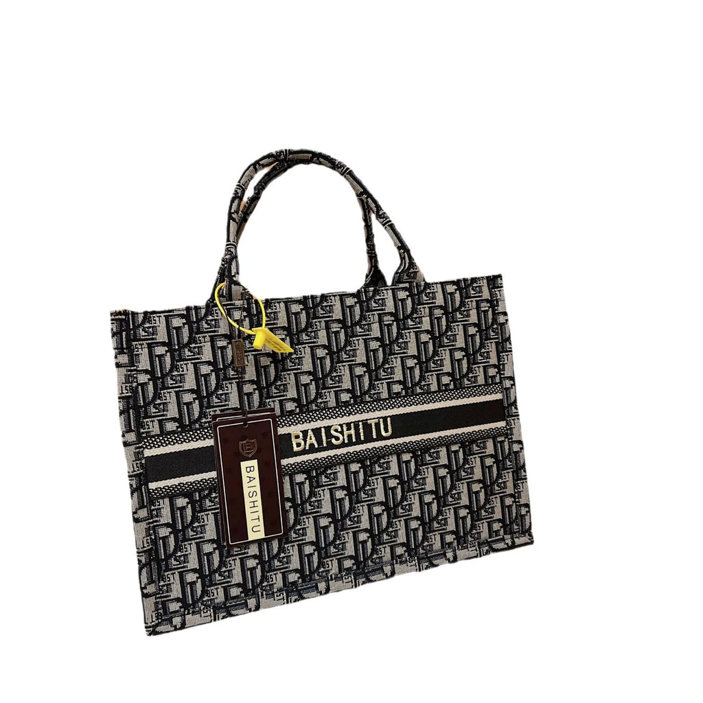 Black and white monogram canvas tote bag with Baishitu logo stripe, twin handles, and rectangular structured design.
