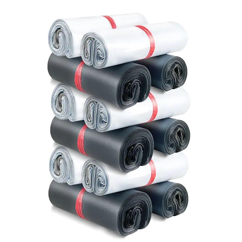 Rolled poly mailer bags in gray, black, and white, bundled with red ties