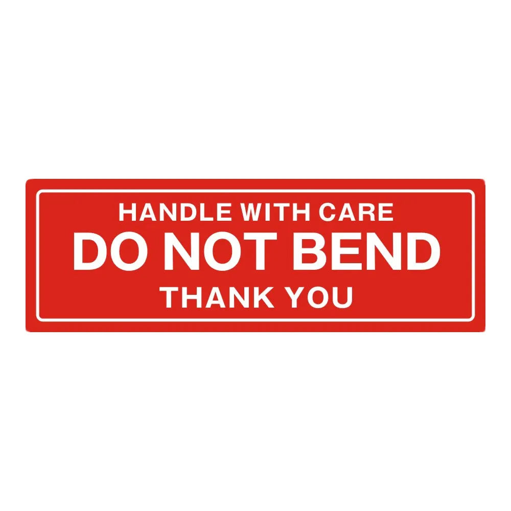 Red “Handle with care—Do not bend” shipping warning sticker