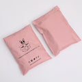 Pink poly mailer shipping bags with bunny logo and social icons print