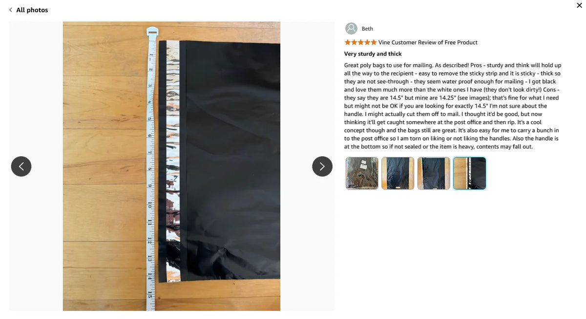 Black poly mailer with sealed edge, close-up with shipping label panel