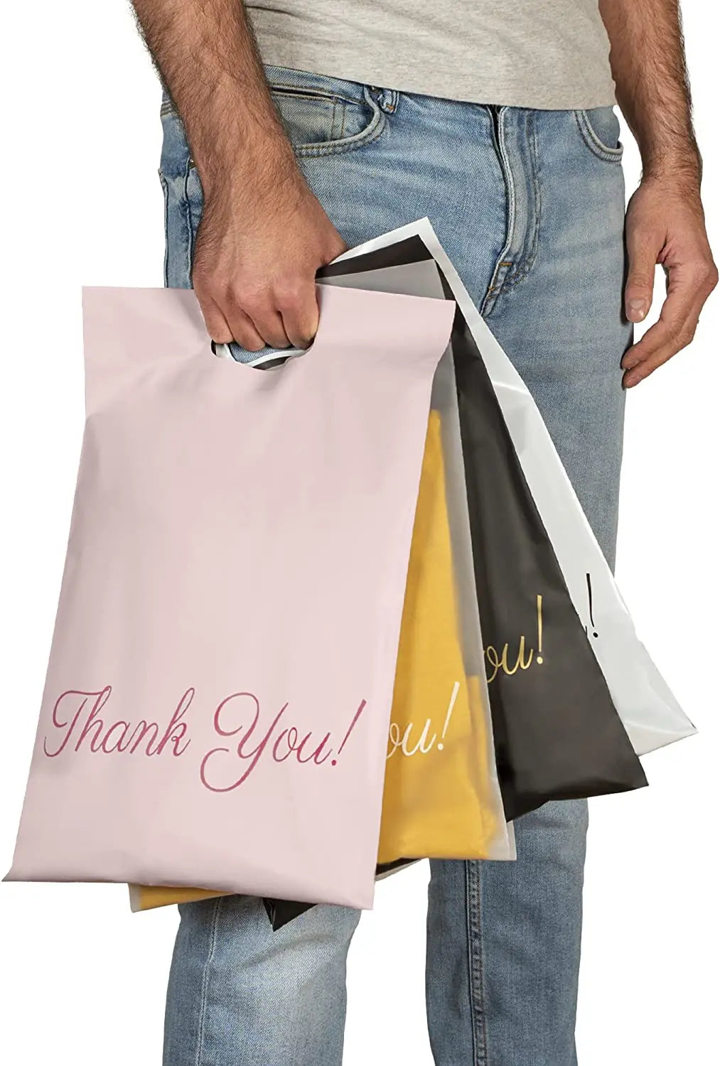 White handle shipping bag held in hand, 'Thank You!' print