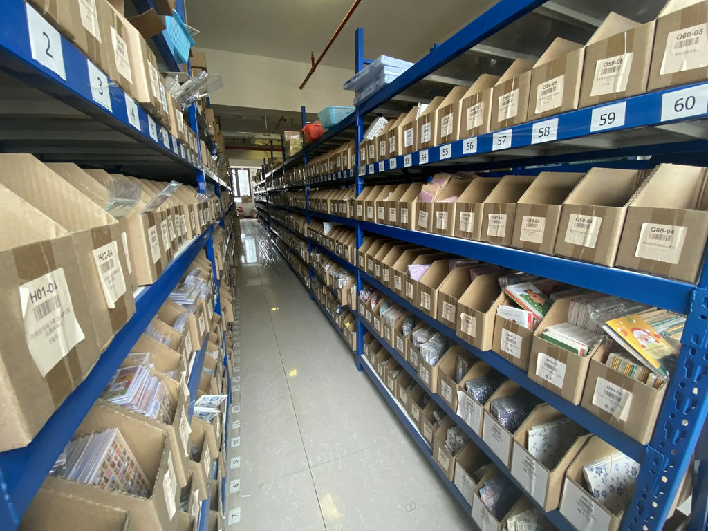 Sticker inventory shelves with boxed items in warehouse racks (adhesive stickers not clearly shown)