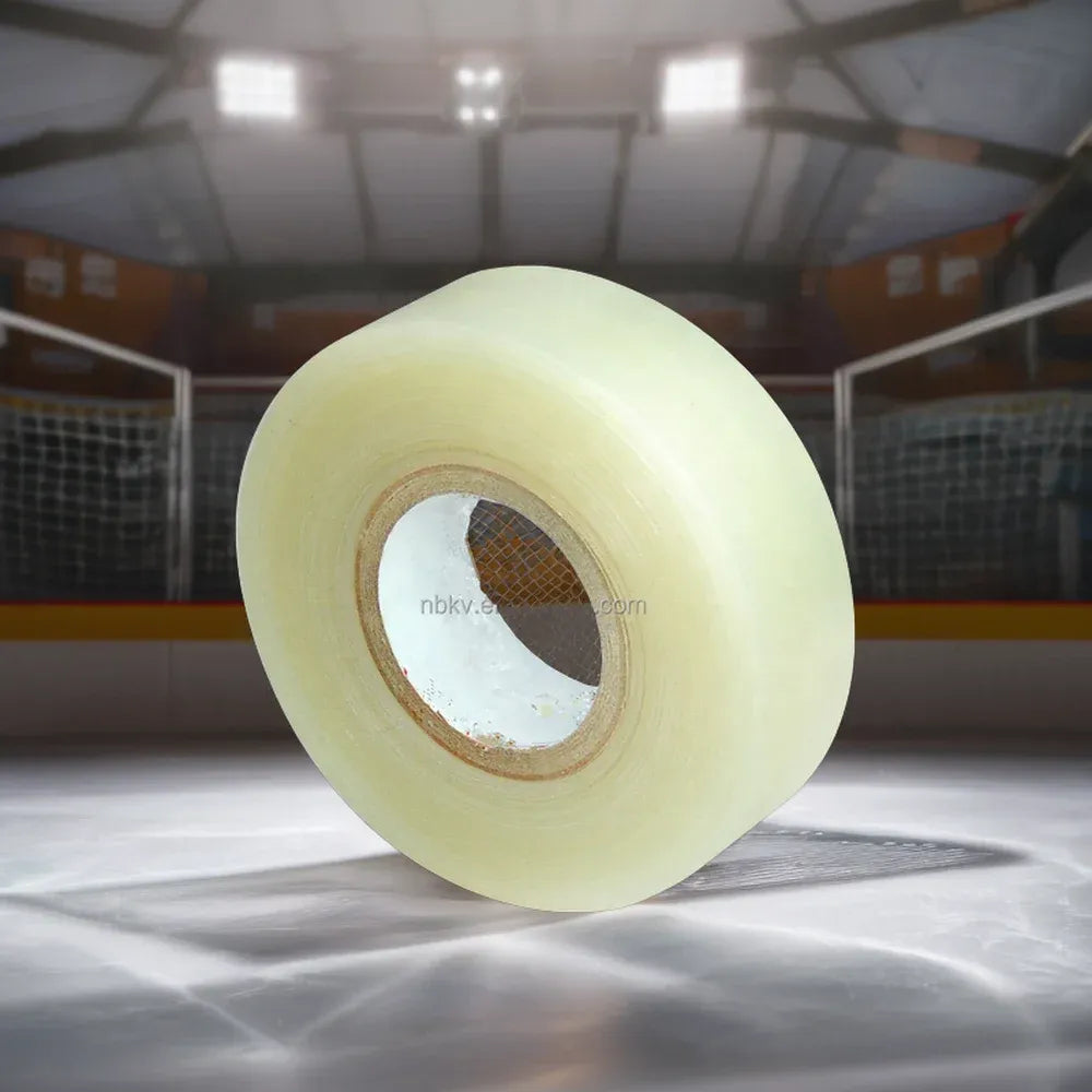 Pale yellow hockey tape roll centered on ice rink surface