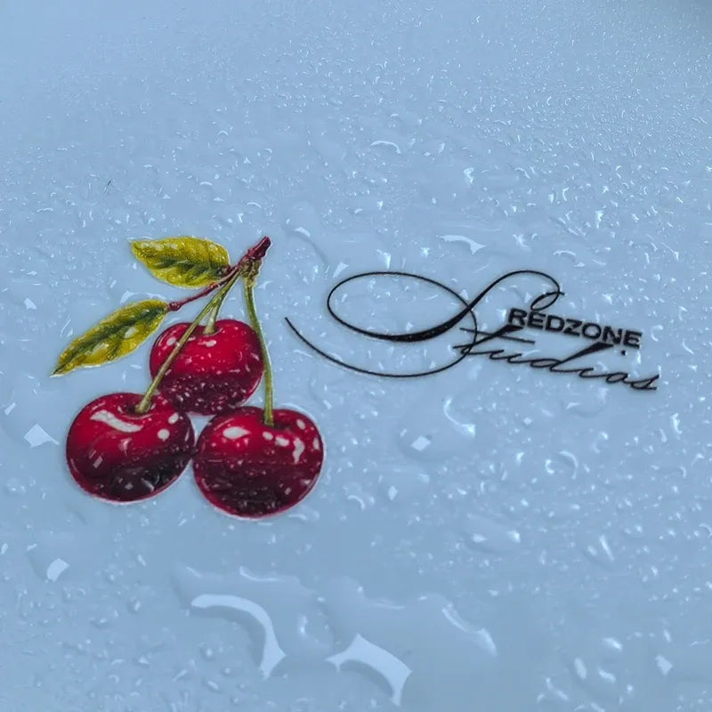 Glossy waterproof die-cut vinyl cherry sticker with green leaves and red fruit design