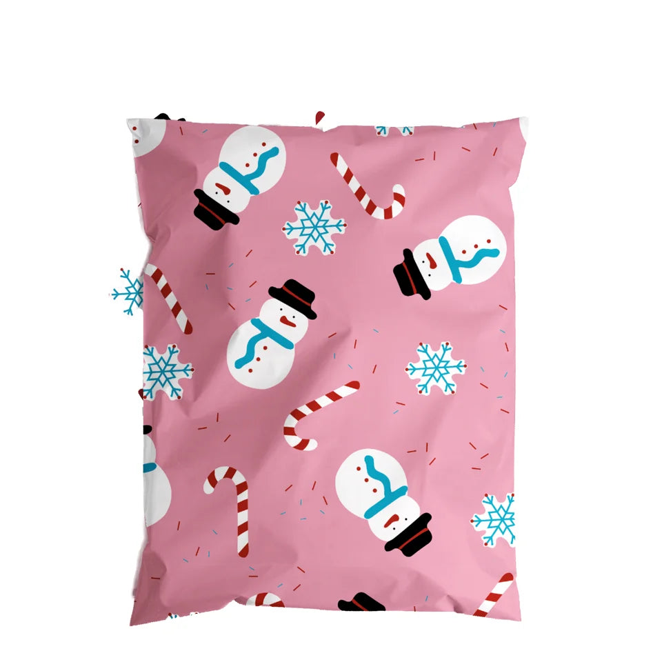 Light pink Christmas poly mailer bag close-up with snowman and candy cane print