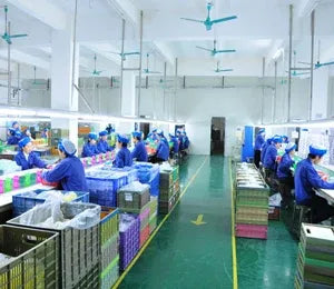 Label printer scale production workshop with staff working at assembly benches