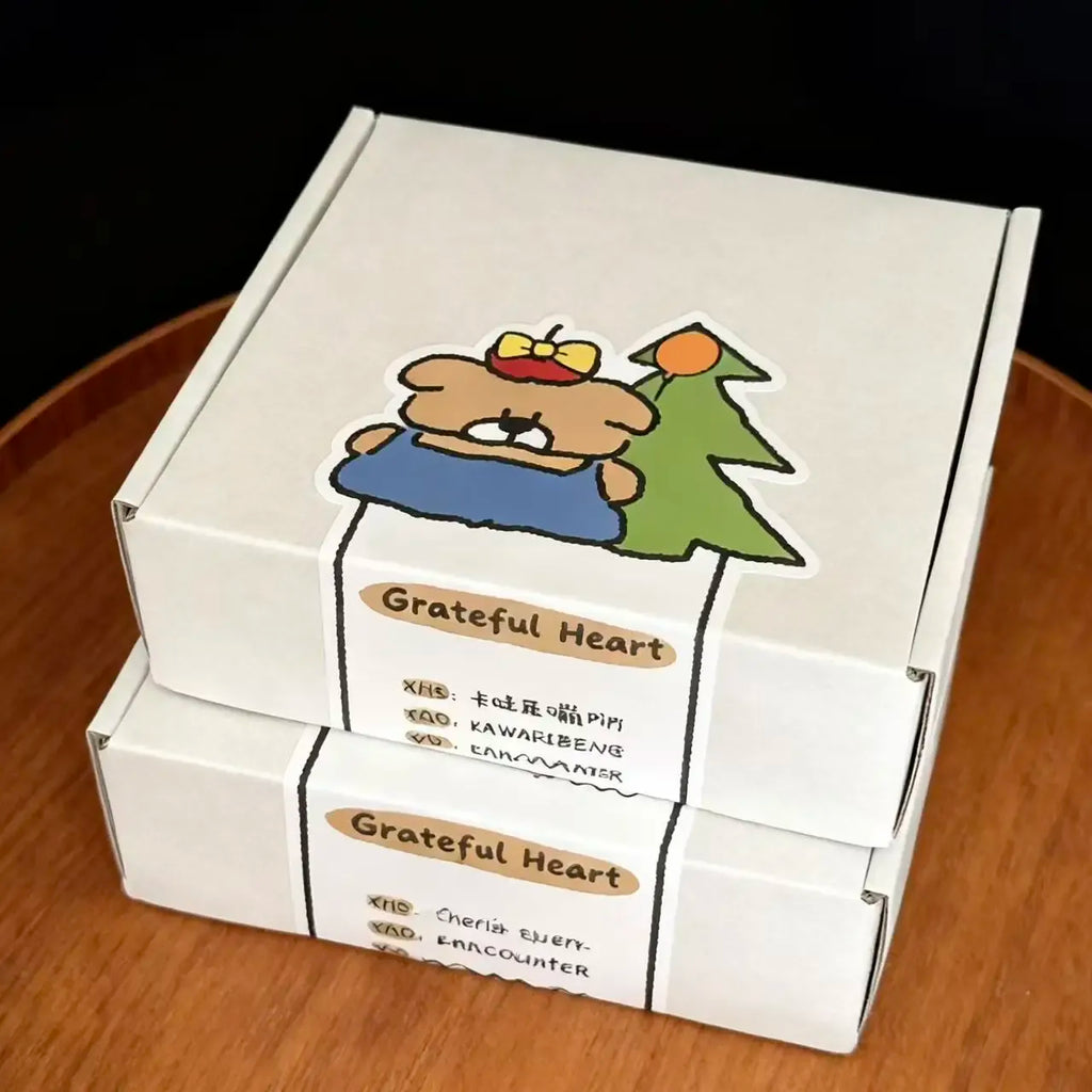 Grateful Heart paper box seal sticker with bear illustration and label text
