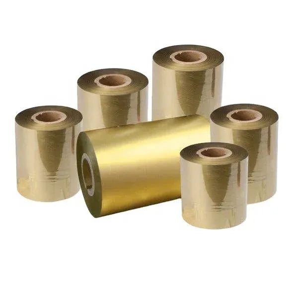 Set of shiny gold metallic thermal transfer ribbon rolls on a white background.