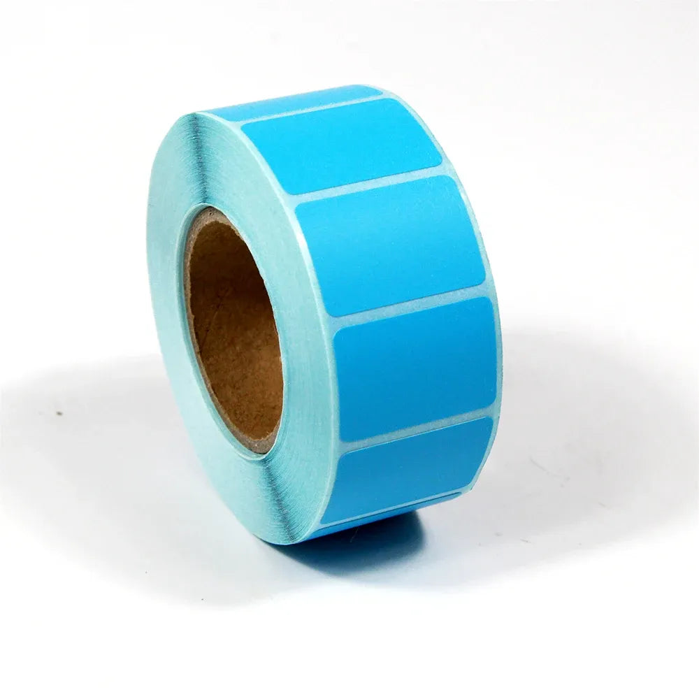 Light blue adhesive label roll with blank rectangular label squares