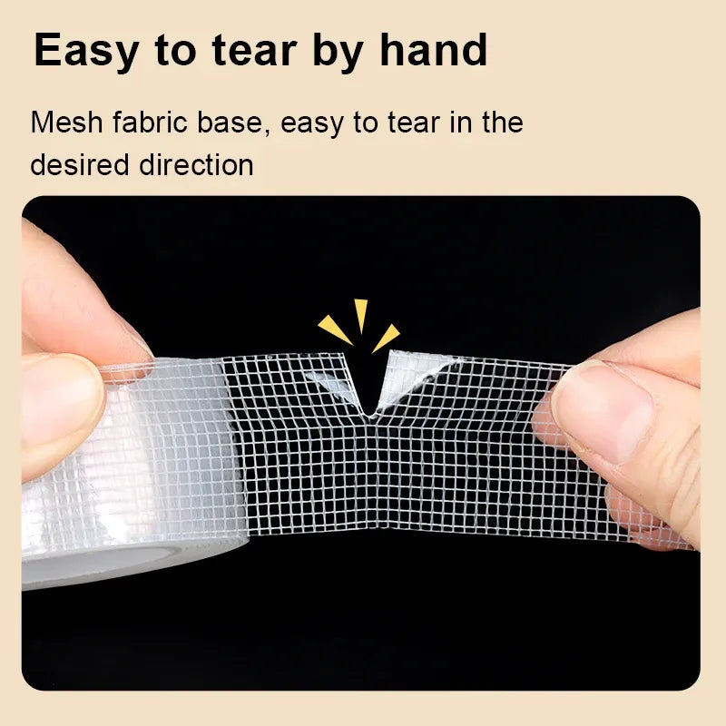 Transparent mesh-backed tape being torn by hand along the grid lines