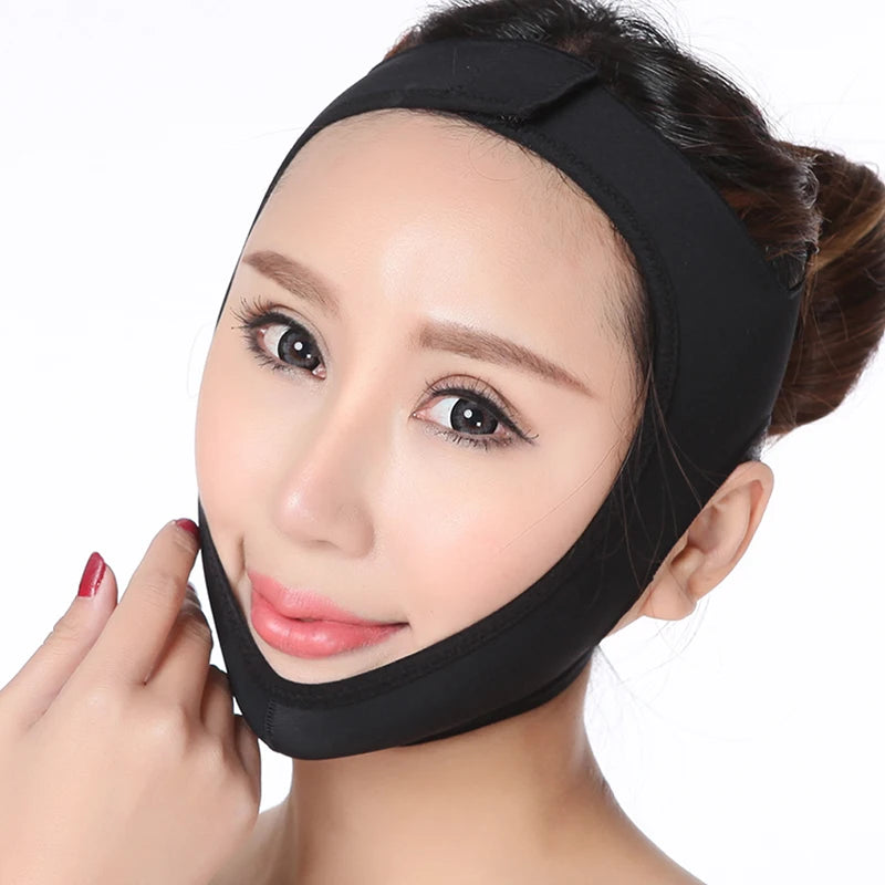 Woman wearing a black, elastic V-line face slimming bandage strap over her chin and top of head.